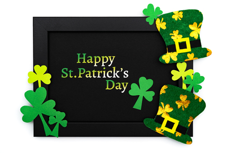 St Patricks day, festive leprechaun hat and green Shamrocks on photo frameの写真素材
