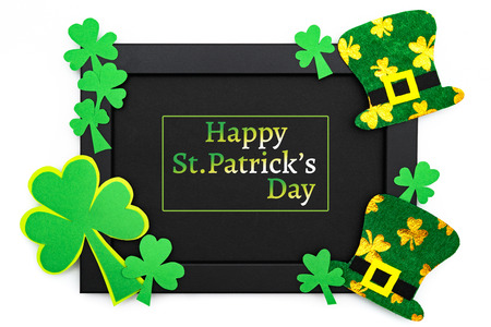 St Patricks day, festive leprechaun hat and green Shamrocks on photo frameの写真素材