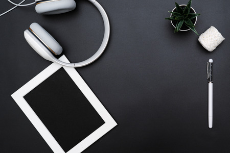 Mockup, Photo Frame, Headphones, Pen, and Cactus Write object on Black backgroundの写真素材