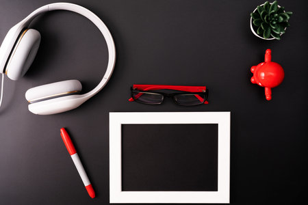 Mockup, Photo Frame, Headphones, Glasses, Pen, and Cactus. Red and Write object on Black background