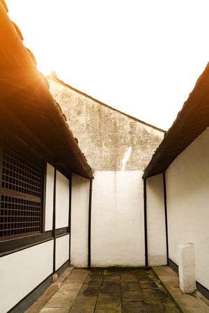 Sunbeam on roof top of Chinese houseの写真素材