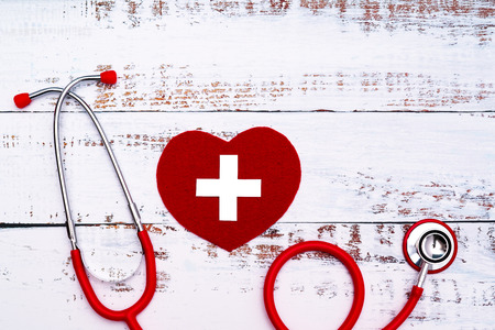World Red Cross day. Red heart with Stethoscope on wooden table backgroundの写真素材