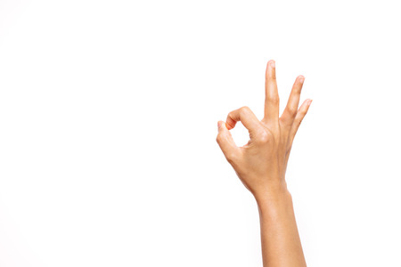 woman hand ok sign on white backgroundの写真素材