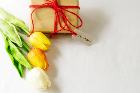 Happy mother's day concept. Gift box and flower, paper tagの写真素材