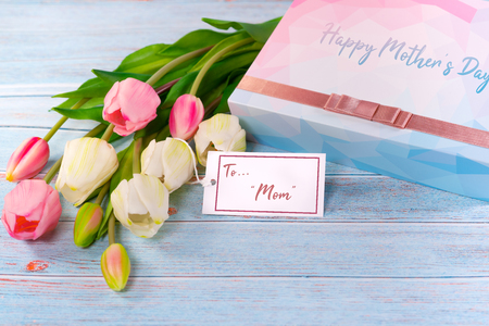 Happy mother's day concept. Gift box and flower, paper tagの写真素材