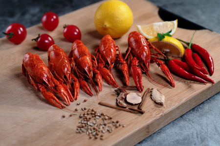 Crayfish or baby Lobster. Red boiled crawfishes on a woodenの写真素材
