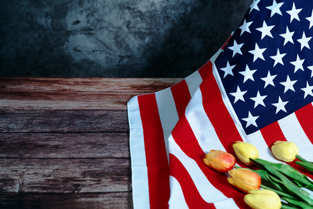 Memorial Day with American flag and flower on wooden backgroundの写真素材