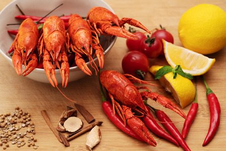 Crayfish or baby Lobster. Red boiled crawfishes on a woodenの写真素材