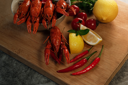 Crayfish or baby Lobster. Red boiled crawfishes on a woodenの写真素材