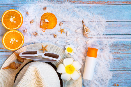 Beautiful summer holiday, Beach accessories, sunglasses, hat and shells on wooden backgroundsの写真素材