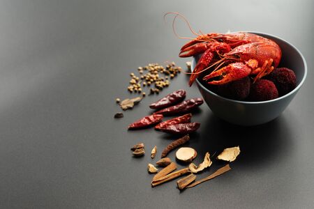 Crayfish red, Baby Lobster with herb for stir fry on black backgroundの写真素材