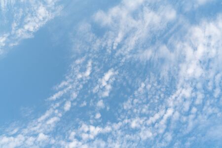white soft cloud texture on blue sky backdropの写真素材