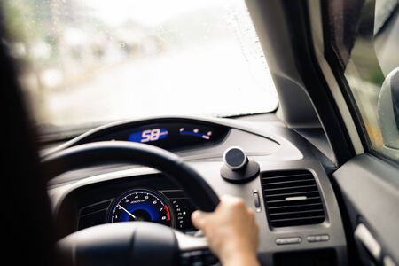 Safe drive on rainy day, speed control and security distance on the road, driving safelyの写真素材