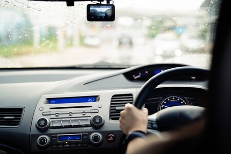 Safe drive on rainy day, speed control and security distance on the road, driving safelyの写真素材