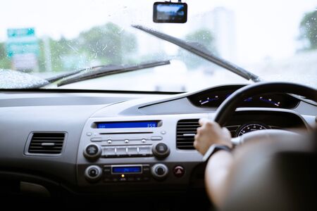 Safe drive on rainy day, speed control and security distance on the road, driving safelyの写真素材