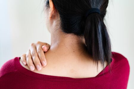 young women neck and shoulder pain injury, healthcare and medical conceptの写真素材