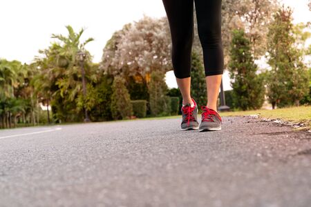 sport woman walking towards on the road side. Step conceptの写真素材