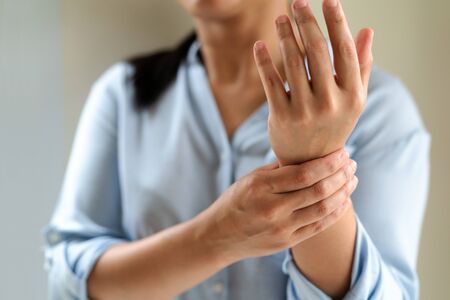 woman wrist arm pain long working. office syndrome healthcare and medicine conceptの写真素材