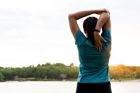 sport woman is stretching muscle after workout