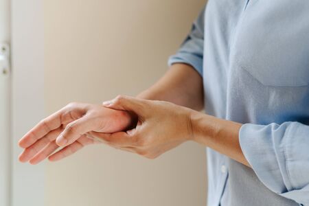 woman wrist arm pain long working. office syndrome healthcare and medicine conceptの写真素材