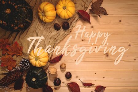 Happy Thanksgiving Day with pumpkin and nut on wooden backgroundの写真素材