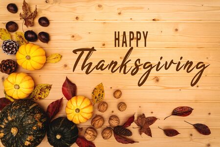 Happy Thanksgiving Day with pumpkin and nut on wooden backgroundの写真素材