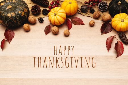Happy Thanksgiving Day with pumpkin and nut on wooden backgroundの写真素材