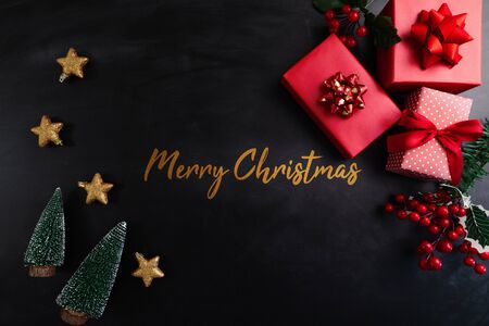 Merry Christmas, xmas present gift and decoration on black backgroundの写真素材