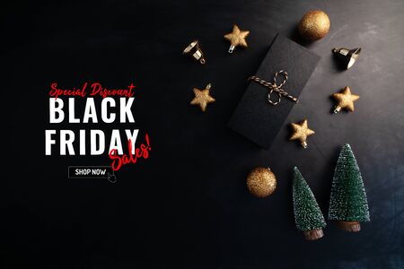 gift box with Christmas decoration for Black Friday Sale concept on black backgroundの写真素材