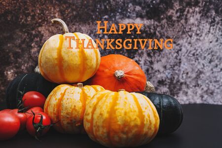 Happy Thanksgiving Day with pumpkin and tomatoの写真素材
