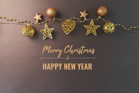 Merry Chrismas and Happy New Year, gold chrismas ball hanging on the backgroundの写真素材