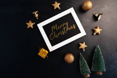Merry Christmas, photo frame with christmas  decoration on black backgroundの写真素材