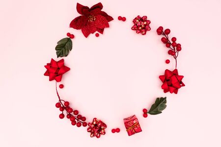 Christmas wreath on pink background. Christmas decoration. Flat lay, top view, copy spaceの写真素材