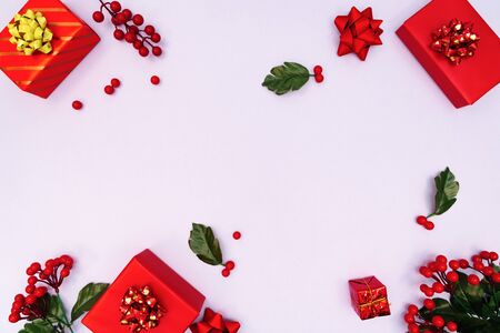 Christmas decoration. red gift box on purple background. Christmas, winter, new year concept. Flat lay, top view, copy spaceの写真素材
