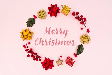 Christmas wreath on pink background. Christmas decoration. Flat lay, top view, copy spaceの写真素材