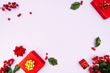 Christmas decoration. red gift box on purple background. Christmas, winter, new year concept. Flat lay, top view, copy spaceの写真素材