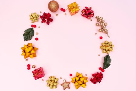 Christmas wreath on pink background. Christmas decoration. Flat lay, top view, copy spaceの写真素材