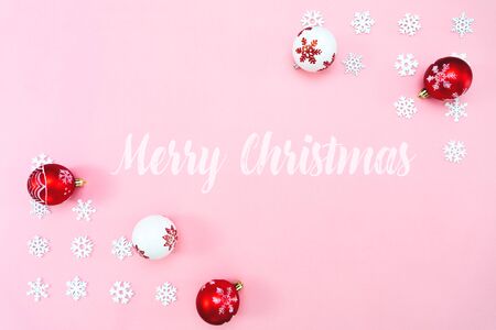 Christmas composition. Christmas balls and snowflakes decorations on pink background. Flat lay, top view, copy spaceの写真素材