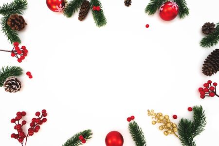 Christmas composition. Christmas ball, pine cones, fir branches on white background. Flat lay, top view, copy spaceの写真素材