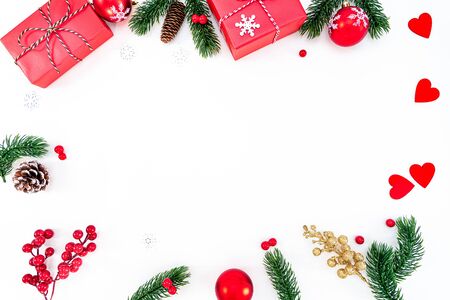 Christmas composition. Christmas ball, pine cones, fir branches on white background. Flat lay, top view, copy spaceの写真素材