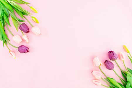 Valentine's Day composition. Tulip flowers on pink background. Valentine's day, Mother's day concept. Flat lay, top view, copy spaceの写真素材