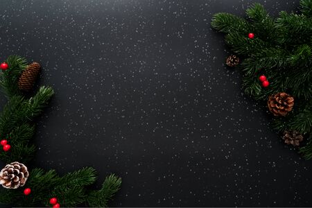 Christmas pine tree with xmas decoration on black backgroundの写真素材