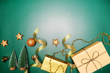 Christmas background concept. Top view of Christmas gift box and decoration on green backgroundの写真素材