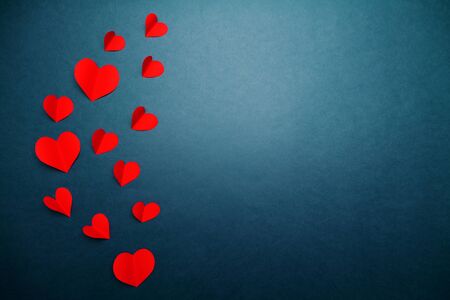 Valentine card with red heart on blue background, abstract, flat lay, top viewの写真素材