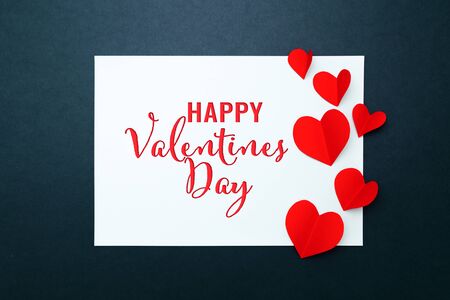 Valentine card with red heart on blue paper frame, flat lay, top viewの写真素材