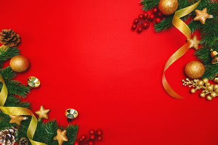 Christmas pine tree with xmas decoration on Red backgroundの写真素材
