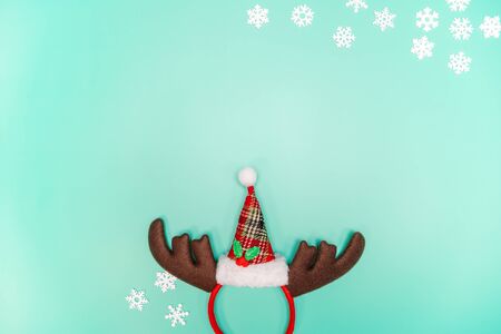 Christmas background concept. Top view of Christmas decoration, Santa Claus and reindeer on green backgroundの写真素材