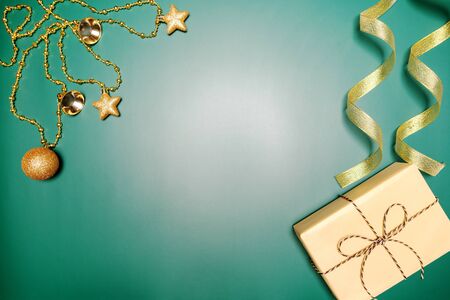 Christmas background concept. Top view of Christmas gift box and decoration on green backgroundの写真素材
