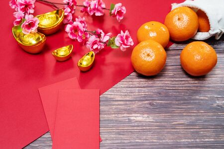 Chinese New Year orange and offering red envelope, Translation of text appear in image: Prosperity, rich and healthyの写真素材