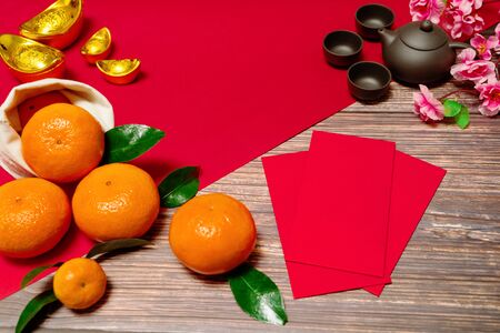 Chinese New Year orange offering red envelope and chinese tea pot, Translation of text appear in image: Prosperity, rich and healthyの写真素材